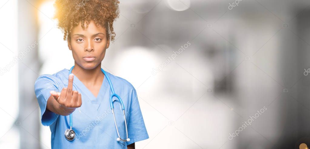 Young african american doctor woman over isolated background Showing middle finger, impolite and rude fuck off expression