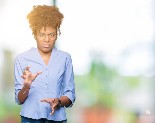 Beautiful young african american business woman over isolated background disgusted expression, displeased and fearful doing disgust face because aversion reaction. With hands raised. Annoying concept.