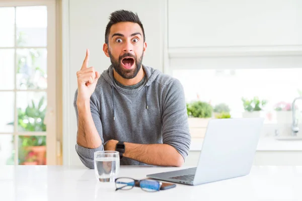 Handsome Hispanic Man Working Using Computer Laptop Pointing Finger Successful — Stock Photo, Image