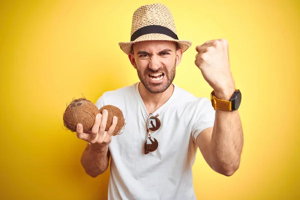 Young Man Wearing Summer Hat Holding Coconut Fruit Yellow Background — Stock Photo, Image