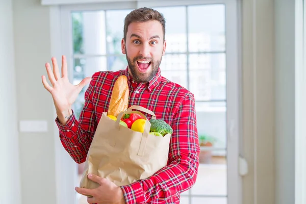 Handsome Man Holding Groceries Bag Very Happy Excited Winner Expression — Stock Photo, Image