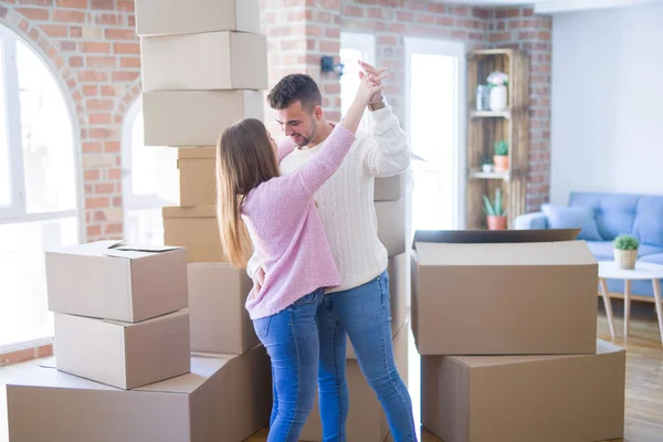 Young beautiful couple in love celebrating dancing moving to a n — Stock Photo, Image