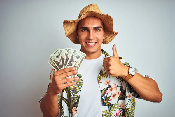Junger Mann Urlaub Mit Dollarnoten Über Weißem Isoliertem Hintergrund Glücklich — Stockfoto