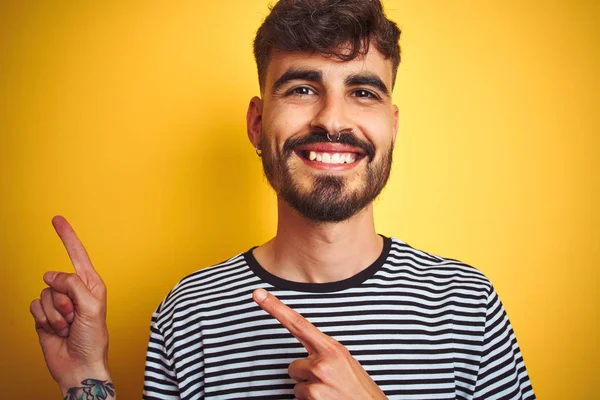 Young Man Tattoo Wearing Striped Shirt Standing Isolated Yellow Background — Stock Photo, Image