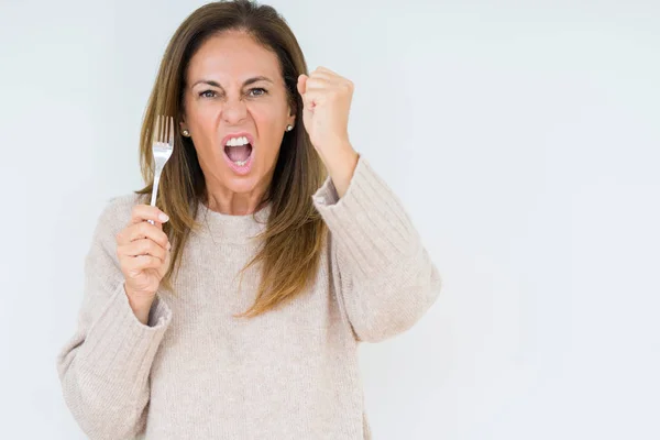 Frau Mittleren Alters Hält Silberne Gabel Metall Über Isolierten Hintergrund — Stockfoto