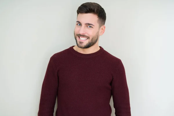 Młody Przystojny Mężczyzna Ubrany Sweter Białym Tle Patrząc Boku Uśmiechem — Zdjęcie stockowe