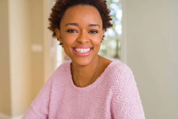 Beautiful young african american woman smiling confident to the