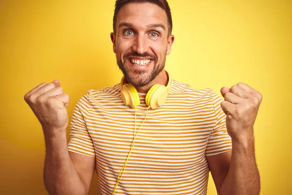Young Handsome Man Wearing Headphones Listening Music Yellow Isolated Background — Stock Photo, Image