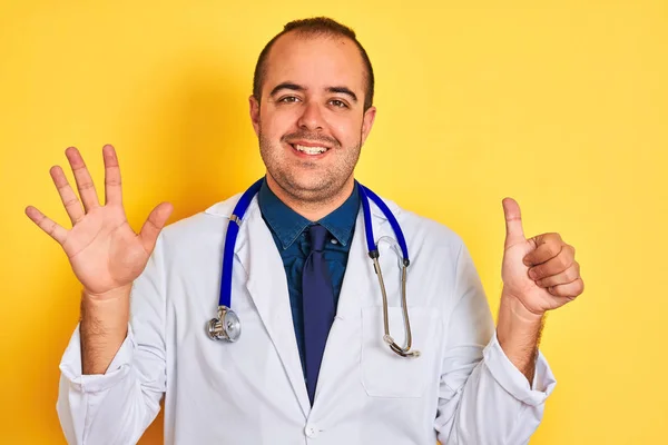 Young Doctor Man Wearing Coat Stethoscope Standing Isolated Yellow Background — Stock Photo, Image