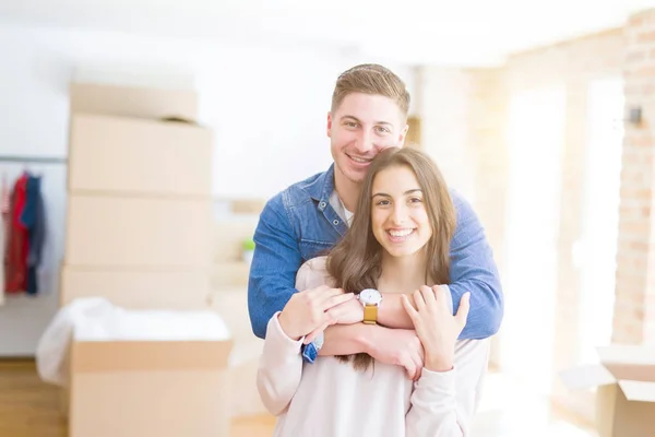 Beautiful Young Couple Moving New Home Standing New Aparment Cardboard Royalty Free Stock Photos