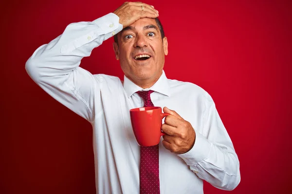 Handsome Middle Age Businessman Holding Cup Coffee Isolated Red Background — Stock Photo, Image