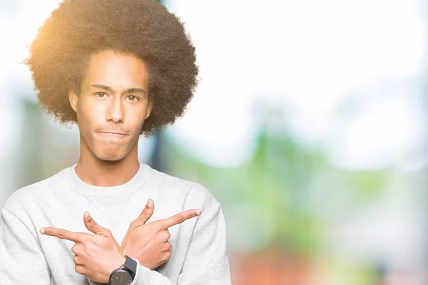 Young African American Man Afro Hair Wearing Sporty Sweatshirt Pointing — Stock Photo, Image