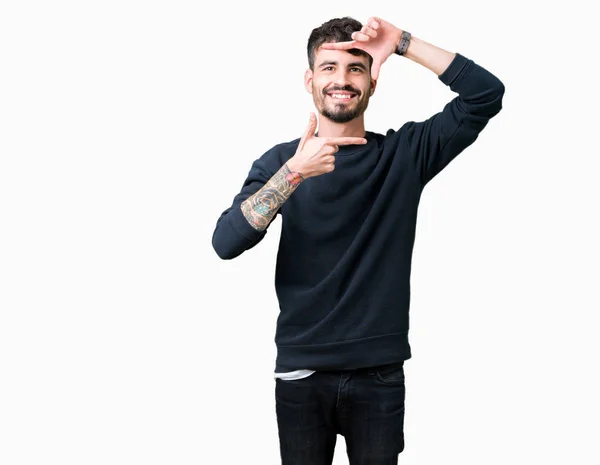 Mladý Pohledný Muž Izolované Pozadí Provedení Rámu Rukama Prsty Šťastné — Stock fotografie