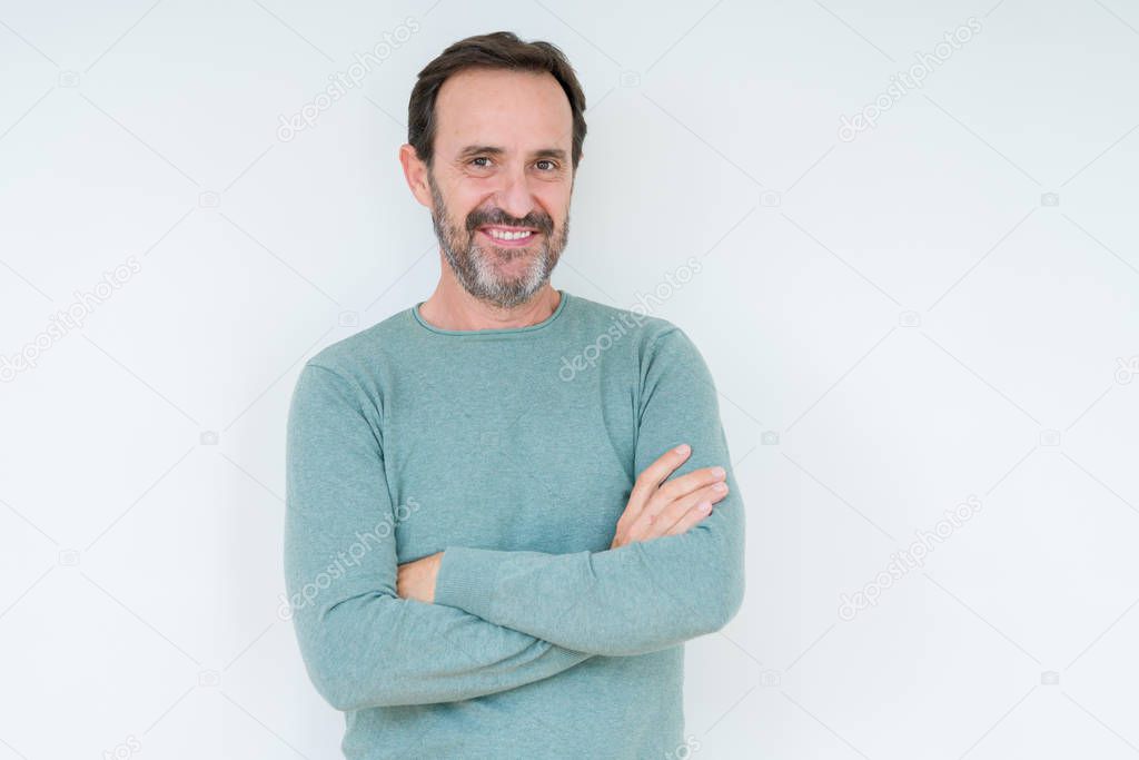 Senior man over isolated background happy face smiling with crossed arms looking at the camera. Positive person.