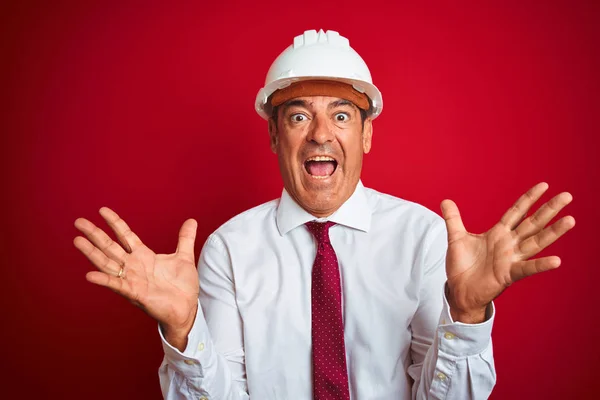 Handsome Middle Age Engineer Man Wearing Security Helmet Isolated Red — Stock Photo, Image