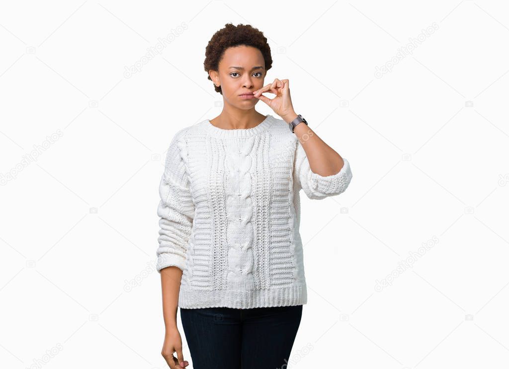 Beautiful young african american woman wearing sweater over isolated background mouth and lips shut as zip with fingers. Secret and silent, taboo talking