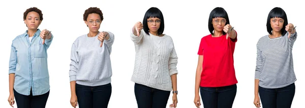 年轻的非洲裔美国妇女与非洲头发在孤立的背景看起来不开心和愤怒显示拒绝和负面的大拇指向下的姿态 错误的表达 — 图库照片