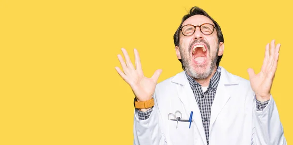 Middle Age Doctor Men Wearing Medical Coat Celebrating Mad Crazy — Stock Photo, Image