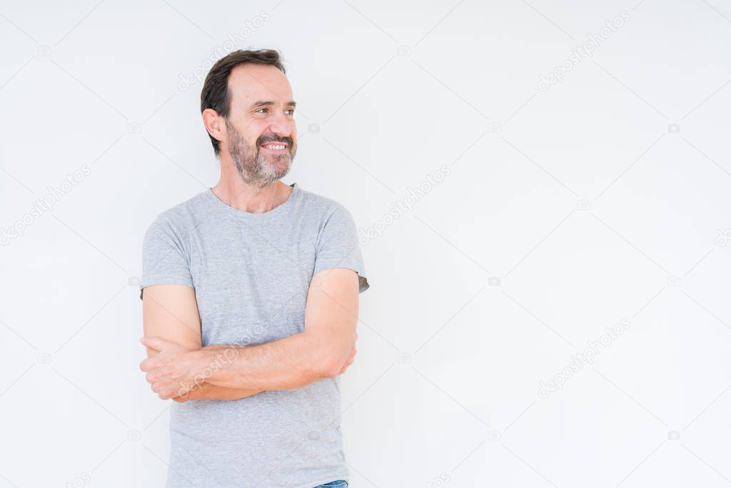 Handsome senior man over isolated background smiling looking side and staring away thinking.