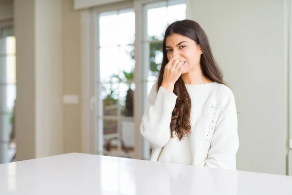 Young Beautiful Woman Home White Table Smelling Something Stinky Disgusting — Stock Photo, Image