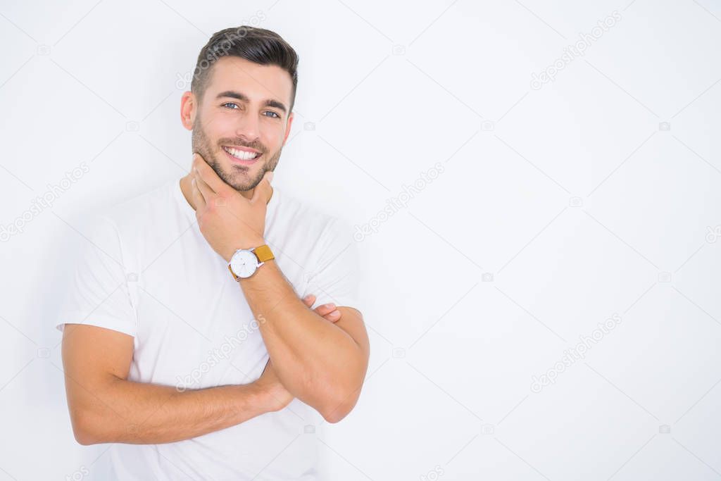 Young handsome man smiling happy wearing casual white t-shirt over white isolated background