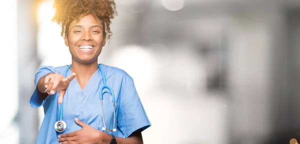Young african american doctor woman over isolated background Laughing of you, pointing to the camera with finger hand over chest, shame expression