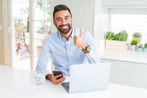 Handsome Hispanic Business Man Using Laptop Smartphone Happy Big Smile — Zdjęcie stockowe