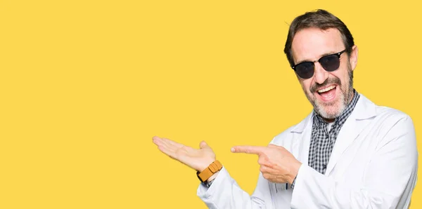 Handsome Middle Age Doctor Man Wearing Sunglasses Amazed Smiling Camera — Stock Photo, Image