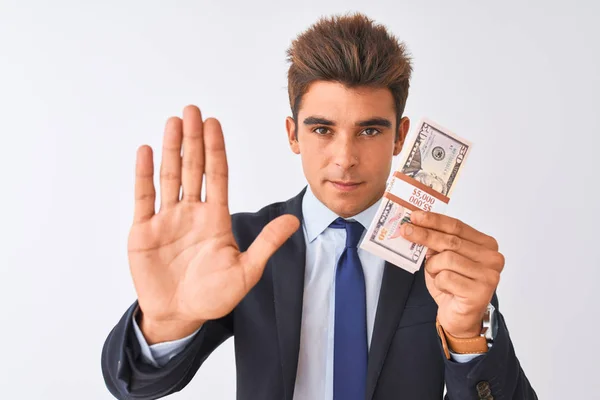 Joven Hombre Negocios Guapo Con Traje Sosteniendo Dólares Sobre Fondo —  Fotos de Stock