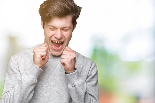 Joven Hombre Deportivo Guapo Con Sudadera Sobre Fondo Aislado Emocionado — Foto de Stock