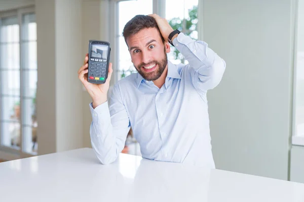 Handsome Young Man Holding Point Sale Terminal Stressed Hand Head — Stock Photo, Image