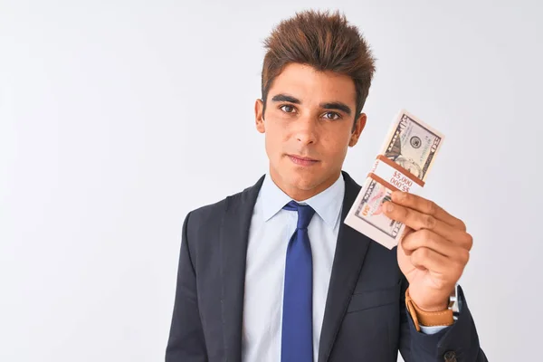 Joven Hombre Negocios Guapo Con Traje Sosteniendo Dólares Sobre Fondo —  Fotos de Stock