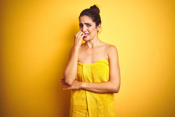 Young Beautiful Woman Wearing Towel Shower Yellow Isolated Background Looking — Stock Photo, Image