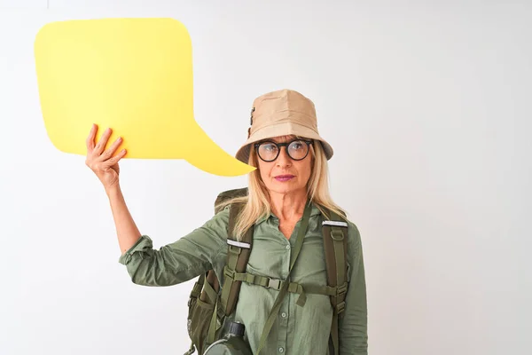 Senior hiker woman wearing canteen holding speech bubble over isolated white background with a confident expression on smart face thinking serious
