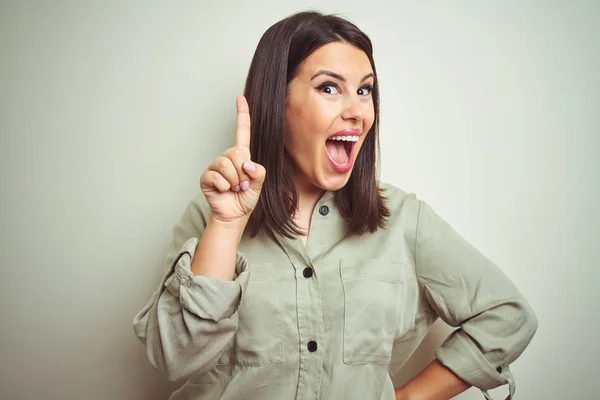 Young Beautiful Brunette Woman Wearing Green Shirt Isolated Background Pointing — Stock Photo, Image