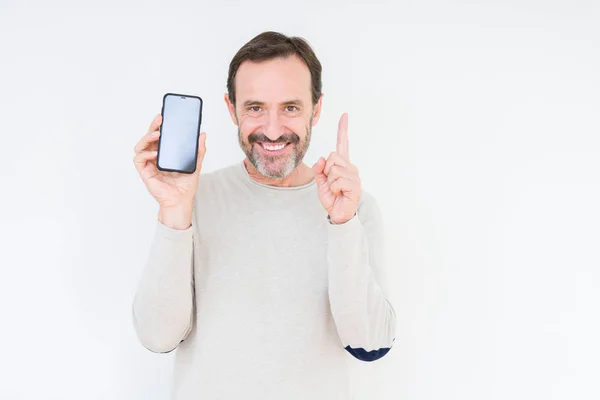 Senior Man Showing Smartphone Screen Isolated Background Surprised Idea Question — Stock Photo, Image