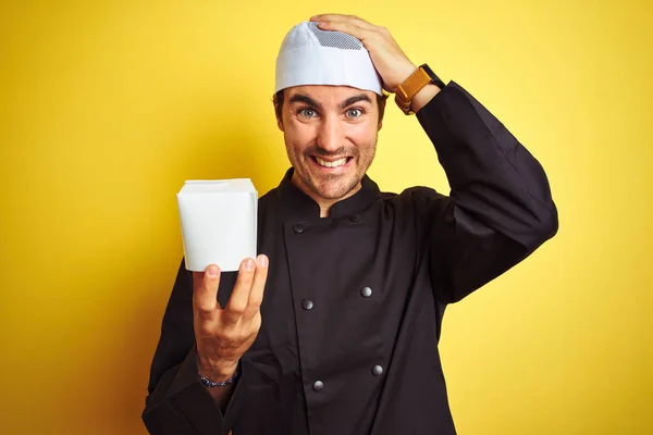 Young Chef Man Wearing Uniform Hat Holding Delivery Box Isolated — Stock fotografie