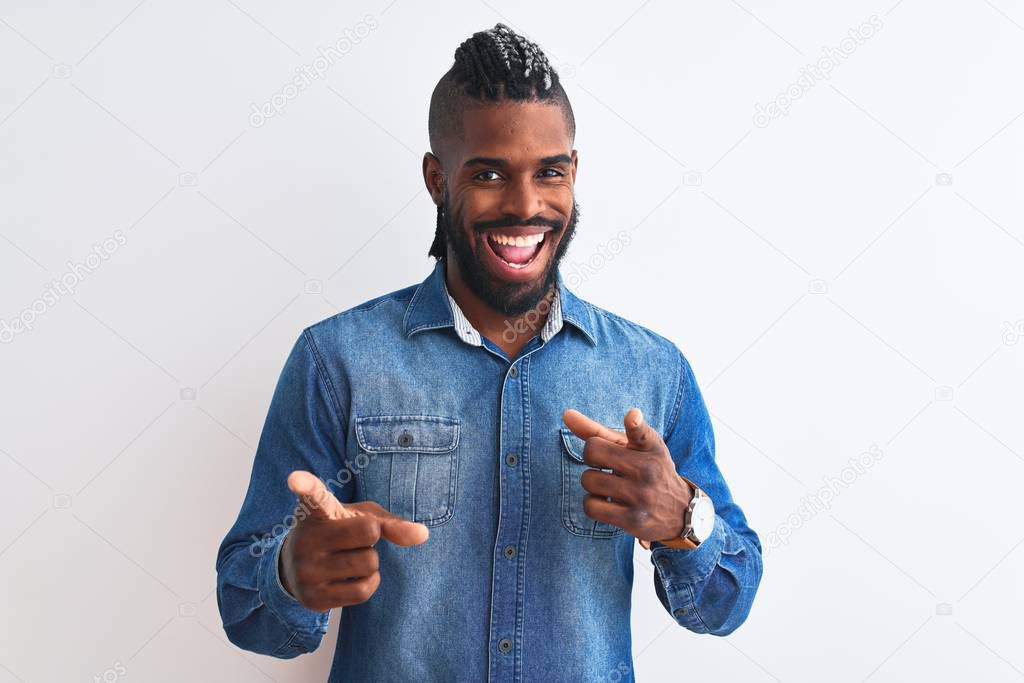 African american man with braids wearing denim shirt over isolated white background pointing fingers to camera with happy and funny face. Good energy and vibes.