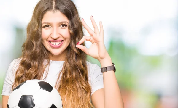 Young Adult Woman Holding Soccer Football Ball Doing Sign Fingers — Stock Photo, Image