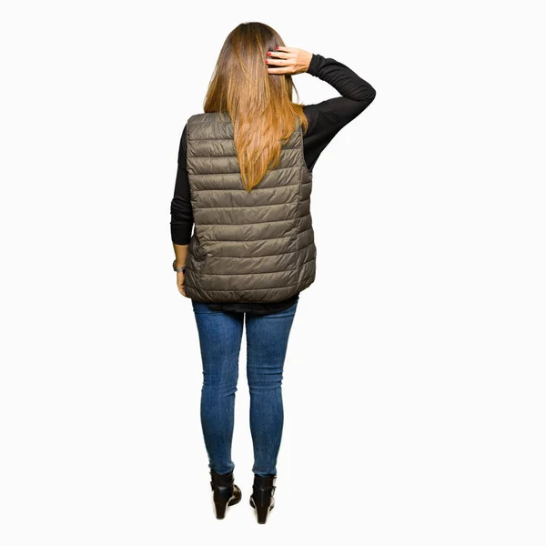 Beautiful Middle Age Woman Wearing Winter Vest Backwards Thinking Doubt — Stock Photo, Image