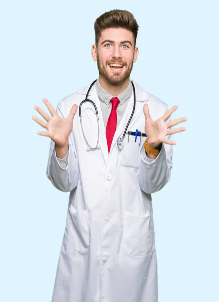 Young Handsome Doctor Man Wearing Medical Coat Celebrating Crazy Amazed — Stock Photo, Image