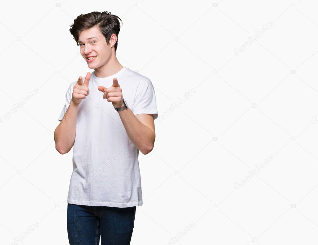 Young handsome man wearing casual white t-shirt over isolated background pointing fingers to camera with happy and funny face. Good energy and vibes.