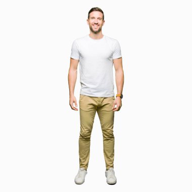 Handsome man wearing casual white t-shirt with a happy and cool smile on face. Lucky person. clipart