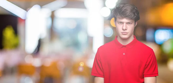 Jonge Knappe Man Dragen Rode Shirt Geïsoleerde Achtergrond Scepticus Nerveus — Stockfoto