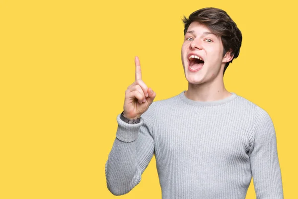 Joven Hombre Guapo Con Suéter Invierno Sobre Fondo Aislado Señalando —  Fotos de Stock