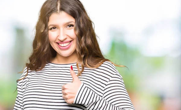 Young Beautiful Woman Wearing Stripes Sweater Doing Happy Thumbs Gesture — Stock Photo, Image