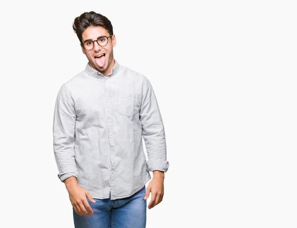 Joven Hombre Guapo Con Gafas Sobre Fondo Aislado Sacando Lengua —  Fotos de Stock