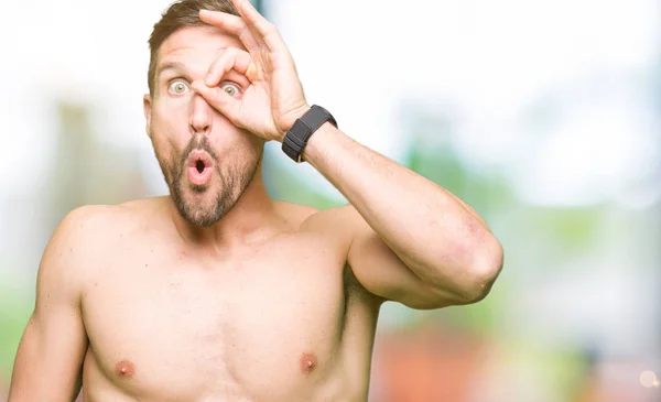 Handsome Shirtless Man Showing Nude Chest Doing Gesture Shocked Surprised — Stock Photo, Image