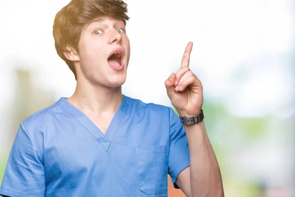 Young Doctor Wearing Medical Uniform Isolated Background Pointing Finger Successful — Stock Photo, Image