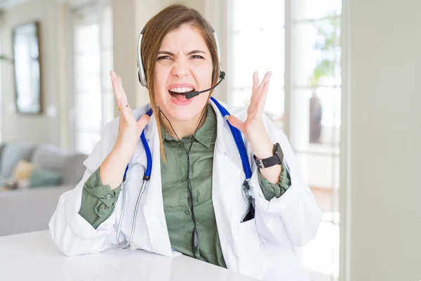 Beautiful Young Doctor Woman Wearing Headset Celebrating Mad Crazy Success — Stock Photo, Image